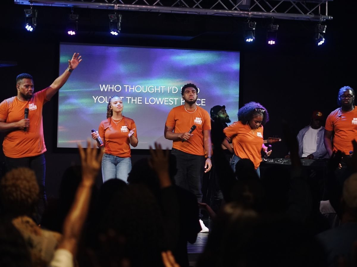 The Expansion worship team leading the room, hands raised